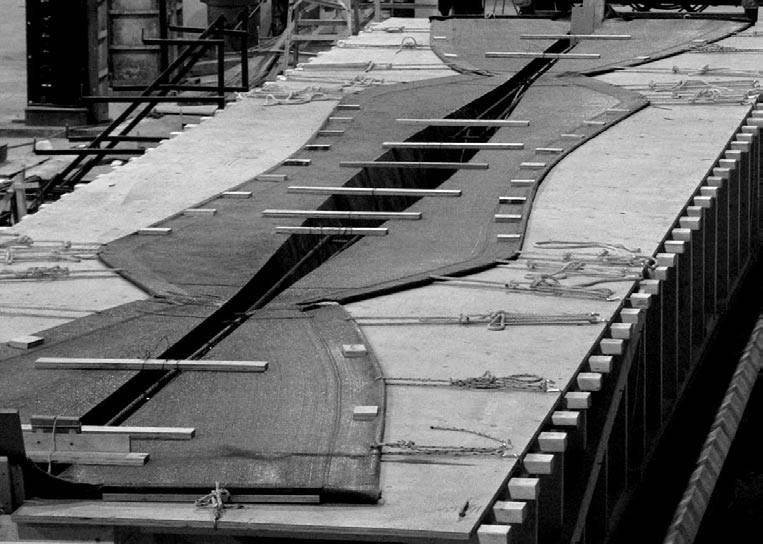 Fig. 11. Plywood deck and fabric formwork for variable section beam.